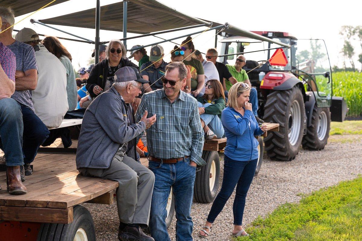 NDSU President David Cook talks chats with a community member during Casselton Field Day